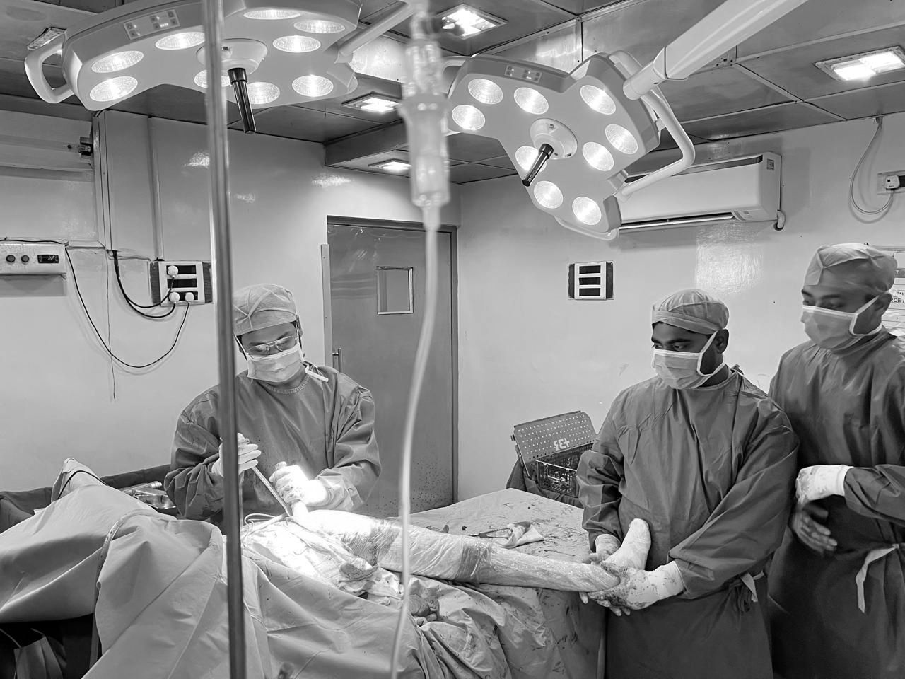 Monochrome leg surgery showcasing professional surgical intervention