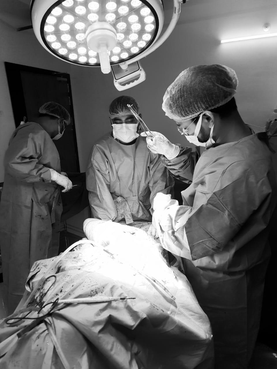 Surgical team performing orthopedic operation